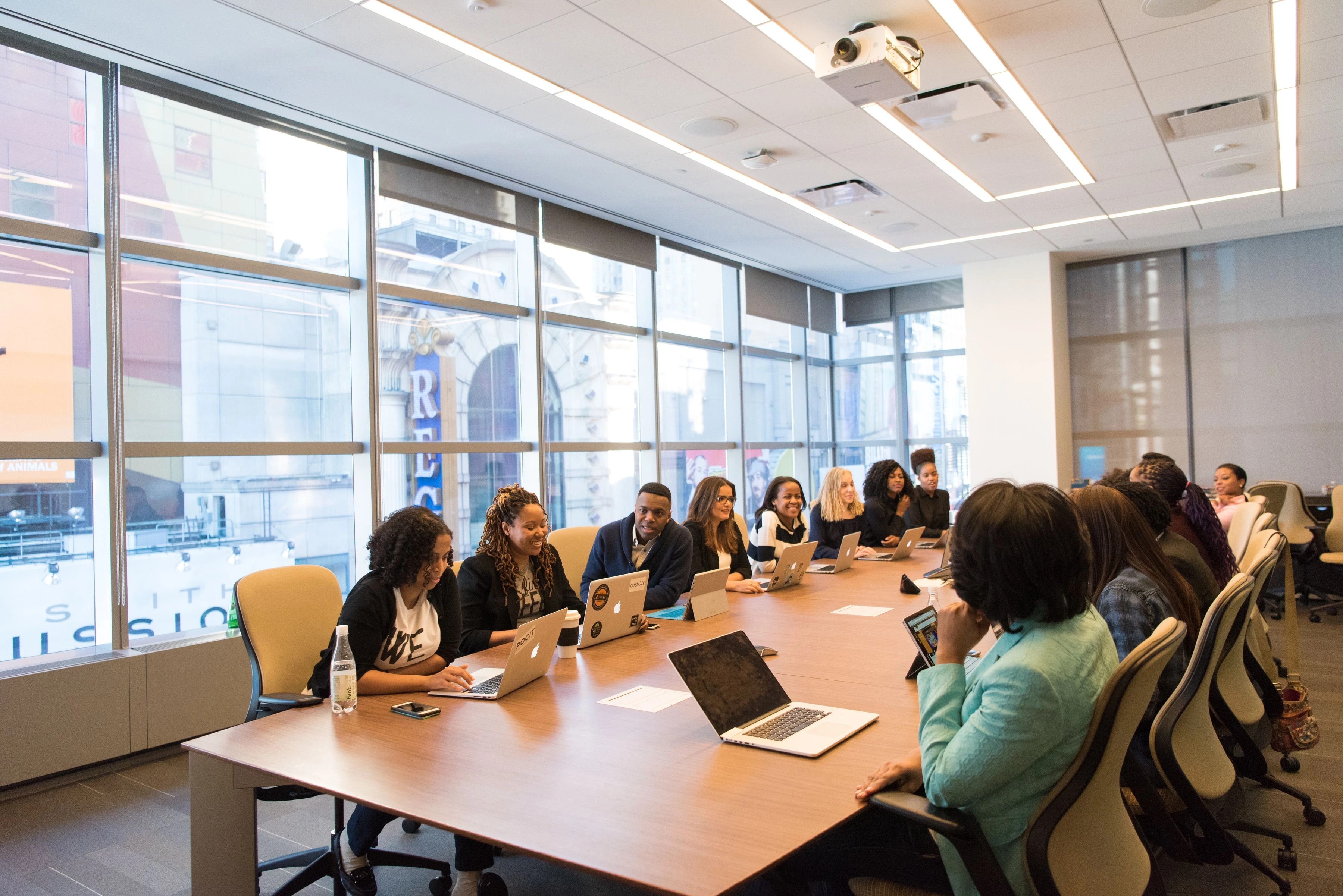 Advisors in a working meeting reviewing documents together
